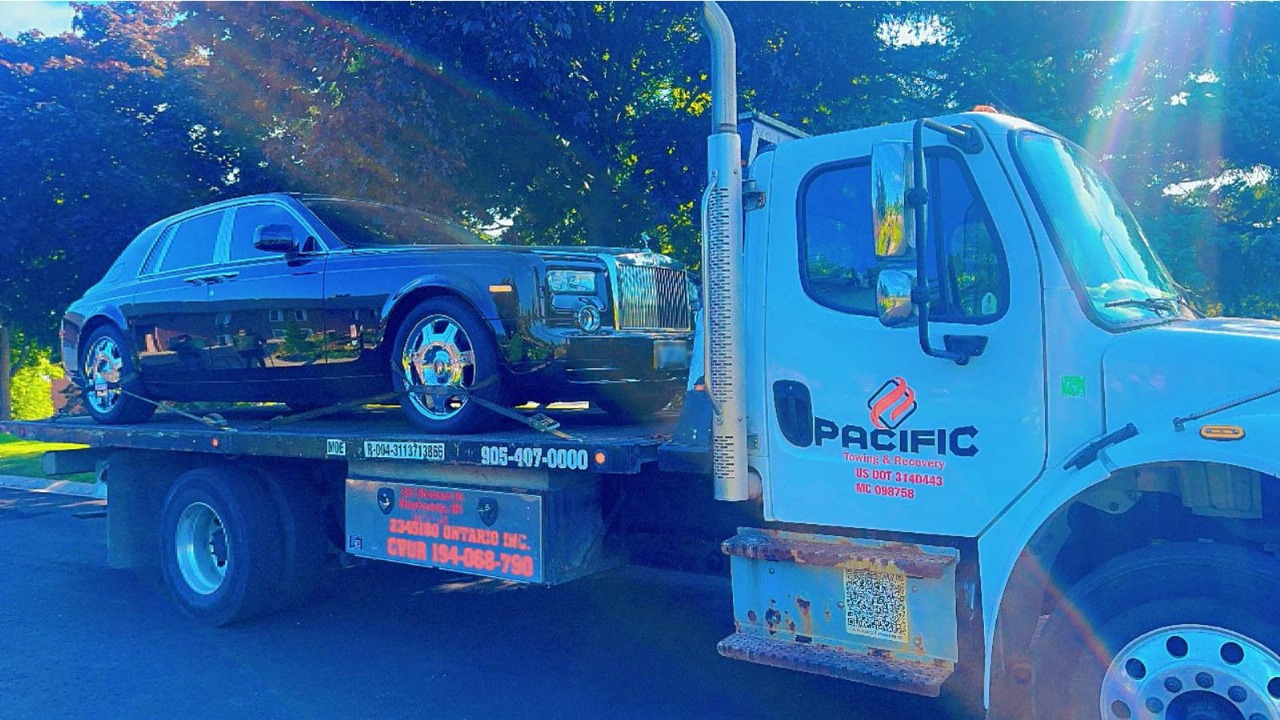 High-end Car on flatbed tow truck 