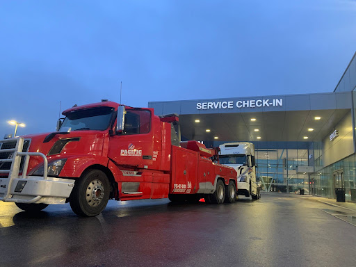 Red heavy towing truck parked.